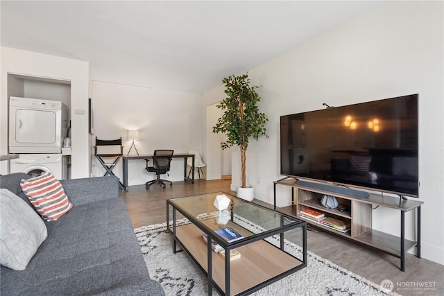 1400 Hubbell Pl Unit 909, Seattle, WA 98101 - living area with stacked washing machine and dryer and wood finished floors