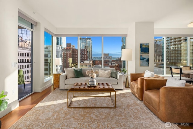 1920 4th Ave Unit 1105, Seattle, WA 98101 - living area with a city view and wood finished floors