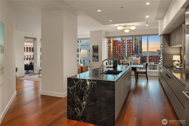 1920 4th Ave Unit 1105, Seattle, WA 98101 - kitchen with modern cabinets, dark countertops, dark wood-style floors, and recessed lighting