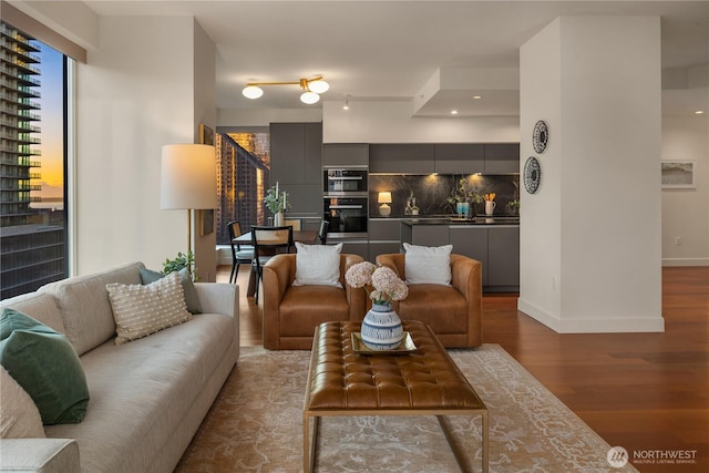 1920 4th Ave Unit 1105, Seattle, WA 98101 - living room featuring wood finished floors and baseboards