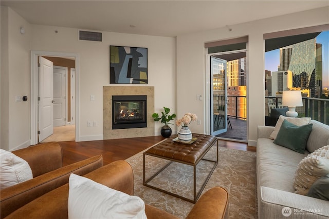 1920 4th Ave Unit 1105, Seattle, WA 98101 - living room featuring wood finished floors and a multi sided fireplace