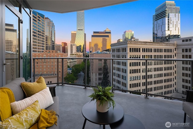 1920 4th Ave Unit 1105, Seattle, WA 98101 - balcony at dusk featuring a view of skyline
