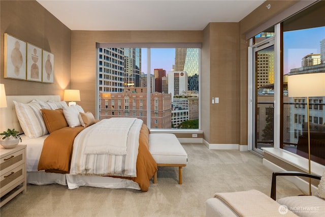 1920 4th Ave Unit 1105, Seattle, WA 98101 - bedroom with carpet floors, a view of city, multiple windows, and access to exterior