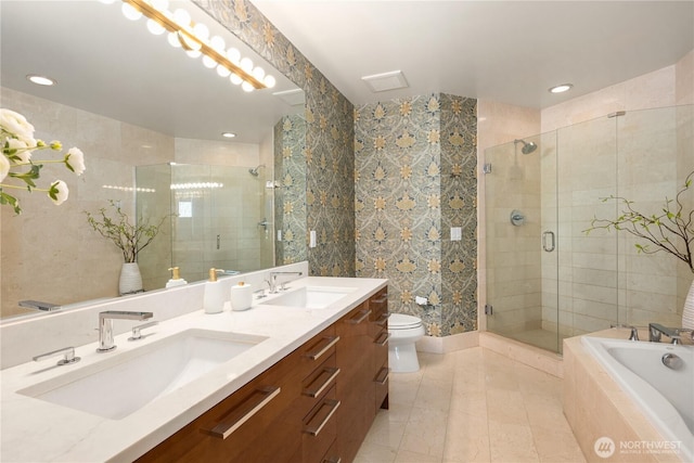 1920 4th Ave Unit 1105, Seattle, WA 98101 - full bath with a shower stall, double vanity, a bath, recessed lighting, and tile patterned floors