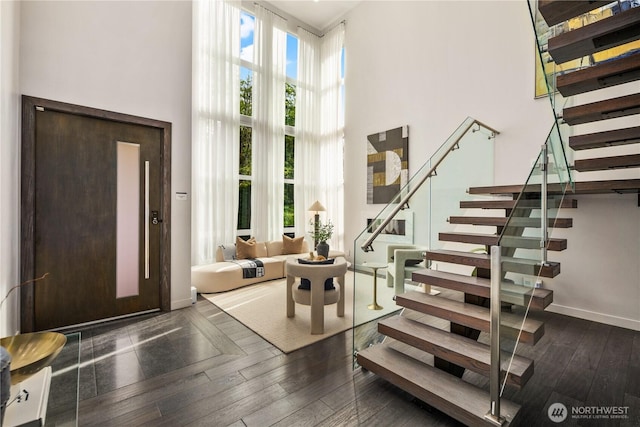 11210 SE 74th St, Newcastle, WA 98056 - entryway featuring a towering ceiling, stairway, and dark wood-type flooring