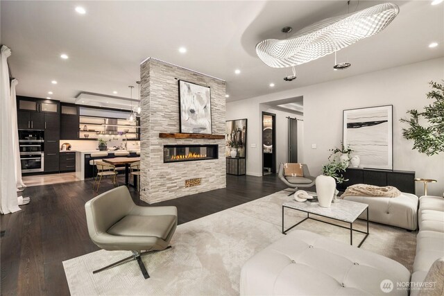 11210 SE 74th St, Newcastle, WA 98056 - living room featuring dark wood-style flooring, recessed lighting, and a fireplace