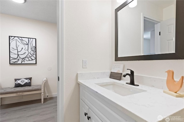 13838 NE 60th St Unit 165, Redmond, WA 98052 - bathroom with vanity and wood finished floors