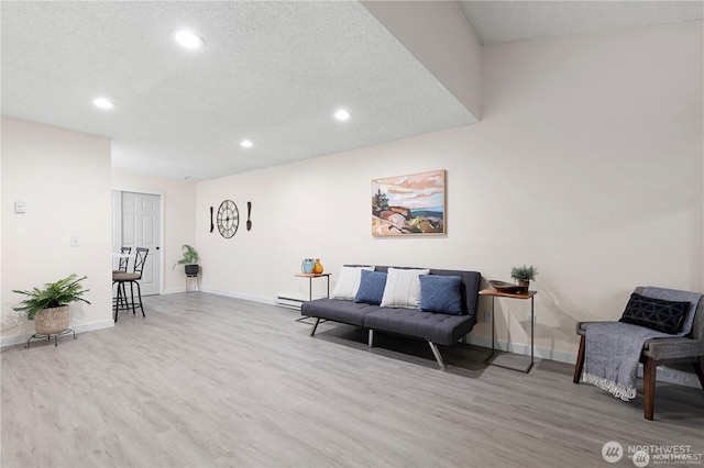 13838 NE 60th St Unit 165, Redmond, WA 98052 - living area with wood finished floors, recessed lighting, and a textured ceiling