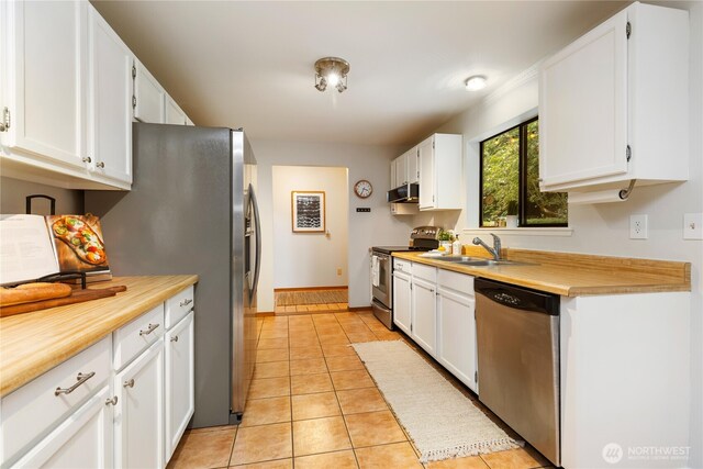 26639 NE Stewart St, Duvall, WA 98019 - kitchen with appliances with stainless steel finishes, light countertops, and white cabinetry