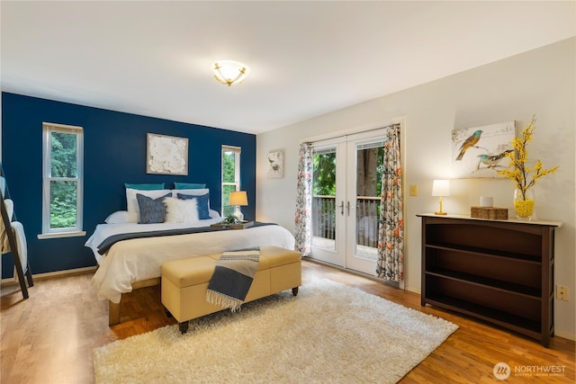 26639 NE Stewart St, Duvall, WA 98019 - bedroom featuring french doors, access to outside, and wood finished floors
