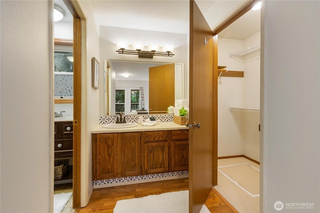 26639 NE Stewart St, Duvall, WA 98019 - bathroom with vanity, wood finished floors, and a spacious closet