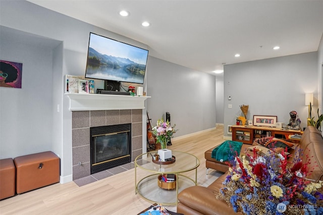 3221 SW Avalon Way Unit 113, Seattle, WA 98126 - living area featuring wood finished floors, recessed lighting, and a tile fireplace