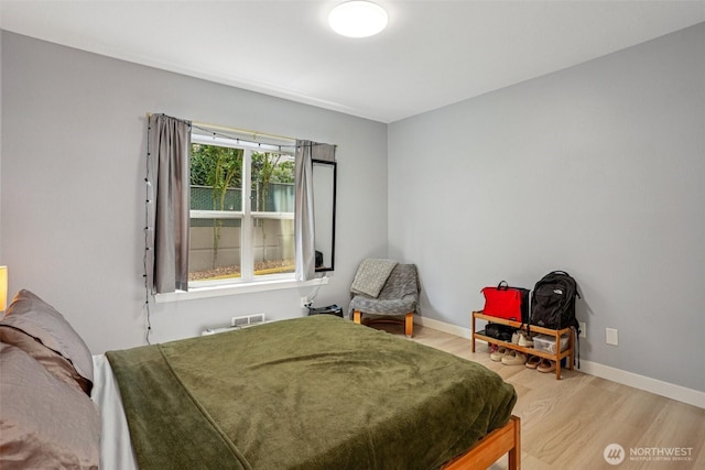 3221 SW Avalon Way Unit 113, Seattle, WA 98126 - bedroom featuring light wood-style floors and baseboards
