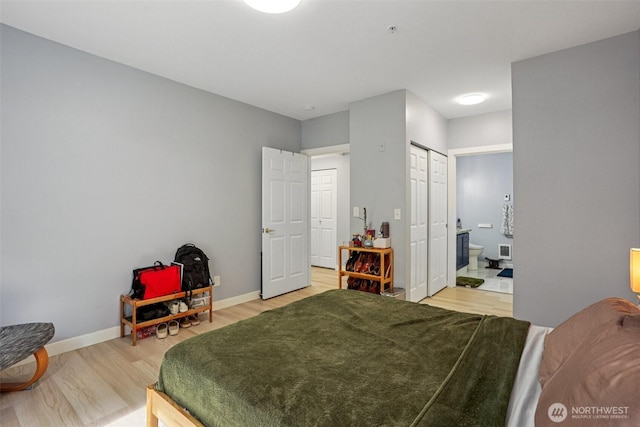 3221 SW Avalon Way Unit 113, Seattle, WA 98126 - bedroom with light wood finished floors and connected bathroom