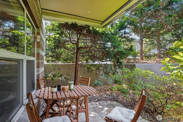 3221 SW Avalon Way Unit 113, Seattle, WA 98126 - view of patio / terrace featuring outdoor dining space