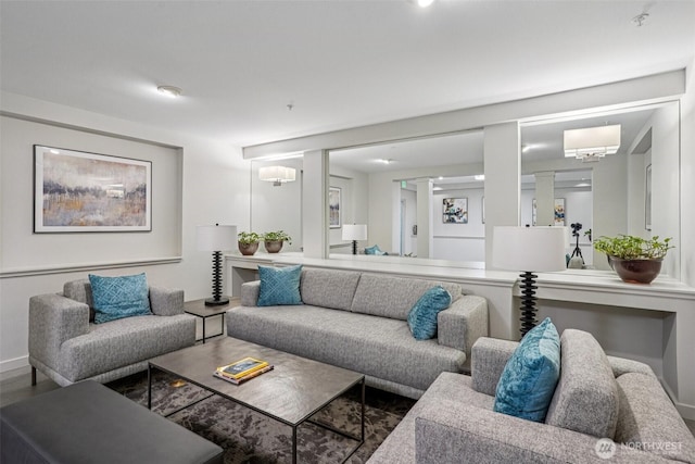 3221 SW Avalon Way Unit 113, Seattle, WA 98126 - living room featuring baseboards and ornate columns