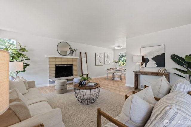13726 SE 24th St, Bellevue, WA 98005 - living room featuring a brick fireplace and wood finished floors