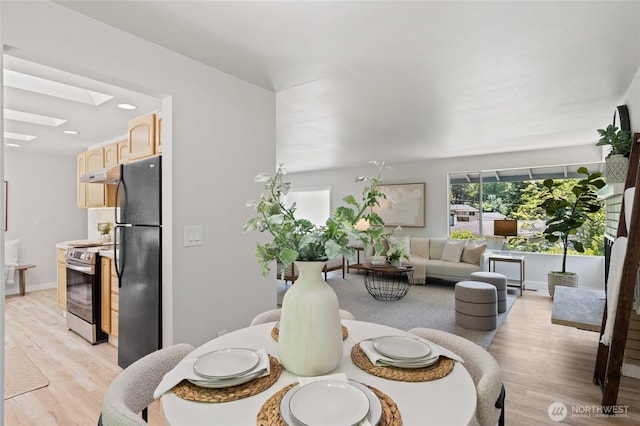 13726 SE 24th St, Bellevue, WA 98005 - dining room with a skylight, light wood-style flooring, and recessed lighting