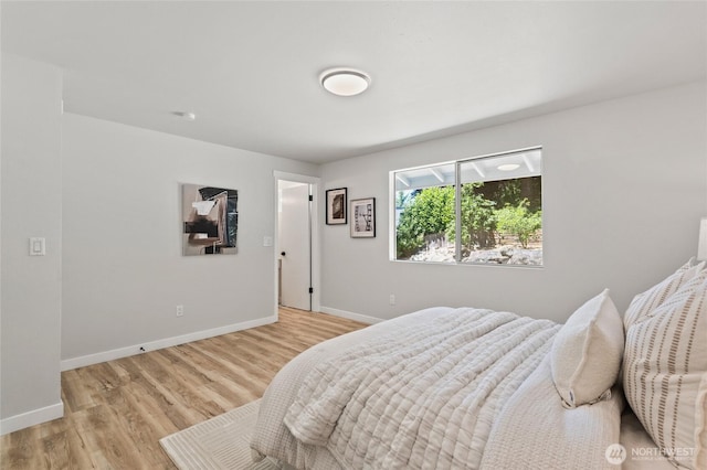 13726 SE 24th St, Bellevue, WA 98005 - bedroom featuring baseboards and light wood-style floors