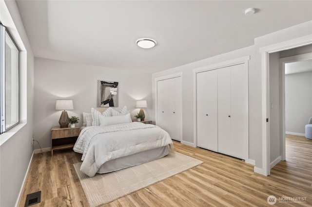 13726 SE 24th St, Bellevue, WA 98005 - bedroom featuring two closets and light wood-style floors