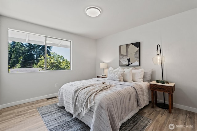 13726 SE 24th St, Bellevue, WA 98005 - bedroom featuring baseboards and wood finished floors