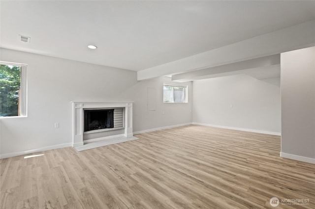 13726 SE 24th St, Bellevue, WA 98005 - unfurnished living room featuring light wood-type flooring, a fireplace with flush hearth, and recessed lighting