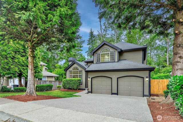 5044 157th Ct NE, Redmond, WA 98052 - view of front facade featuring driveway, a garage, and roof with shingles