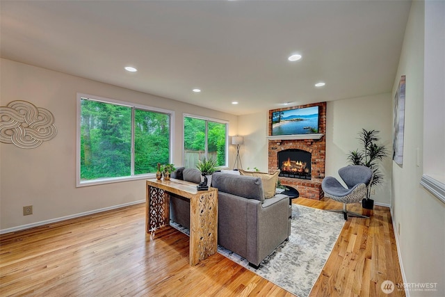 5044 157th Ct NE, Redmond, WA 98052 - living area featuring a fireplace, light wood-type flooring, and recessed lighting