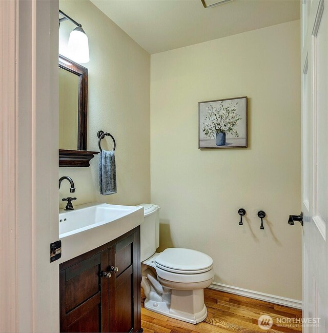 5044 157th Ct NE, Redmond, WA 98052 - half bathroom featuring wood finished floors and vanity