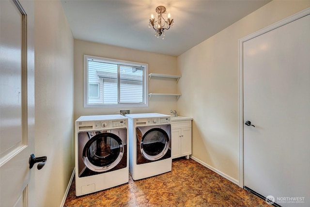 5044 157th Ct NE, Redmond, WA 98052 - laundry room with independent washer and dryer, cabinet space, and a chandelier
