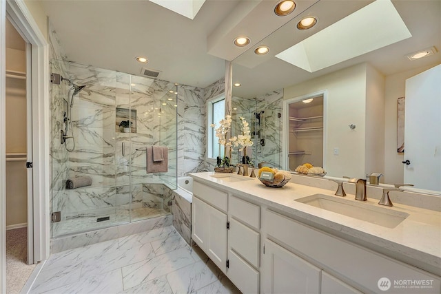 5044 157th Ct NE, Redmond, WA 98052 - full bathroom with a skylight, recessed lighting, a walk in closet, a marble finish shower, and double vanity