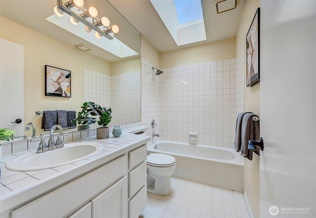 5044 157th Ct NE, Redmond, WA 98052 - bathroom with vanity, a skylight, tile patterned flooring, and shower / bathtub combination