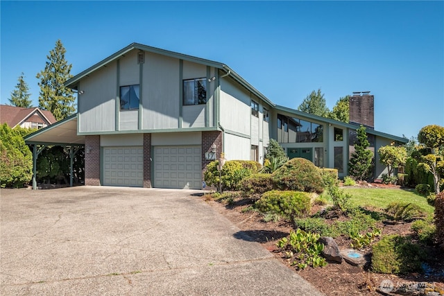 17 Jeffery Pl, Longview, WA 98632 - view of side of property with brick siding, concrete driveway, a garage, and a chimney