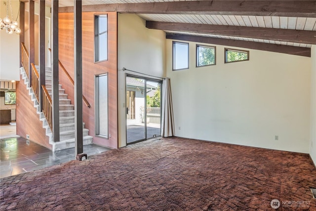 17 Jeffery Pl, Longview, WA 98632 - unfurnished living room featuring a high ceiling, a wood ceiling with exposed beams, stairs, a chandelier, and carpet