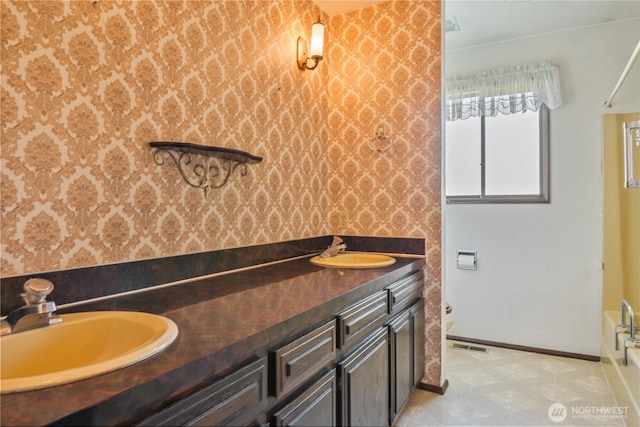 17 Jeffery Pl, Longview, WA 98632 - bathroom featuring wallpapered walls, double vanity, and a tub