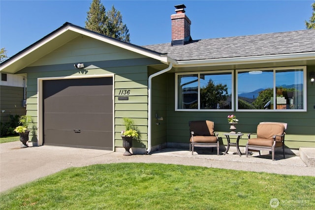 1136 Harding, Enumclaw, WA 98022 - view of front facade featuring concrete driveway, a chimney, a shingled roof, and a front yard