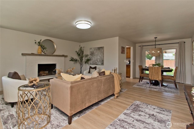 1136 Harding, Enumclaw, WA 98022 - living area featuring light wood-style flooring and a brick fireplace
