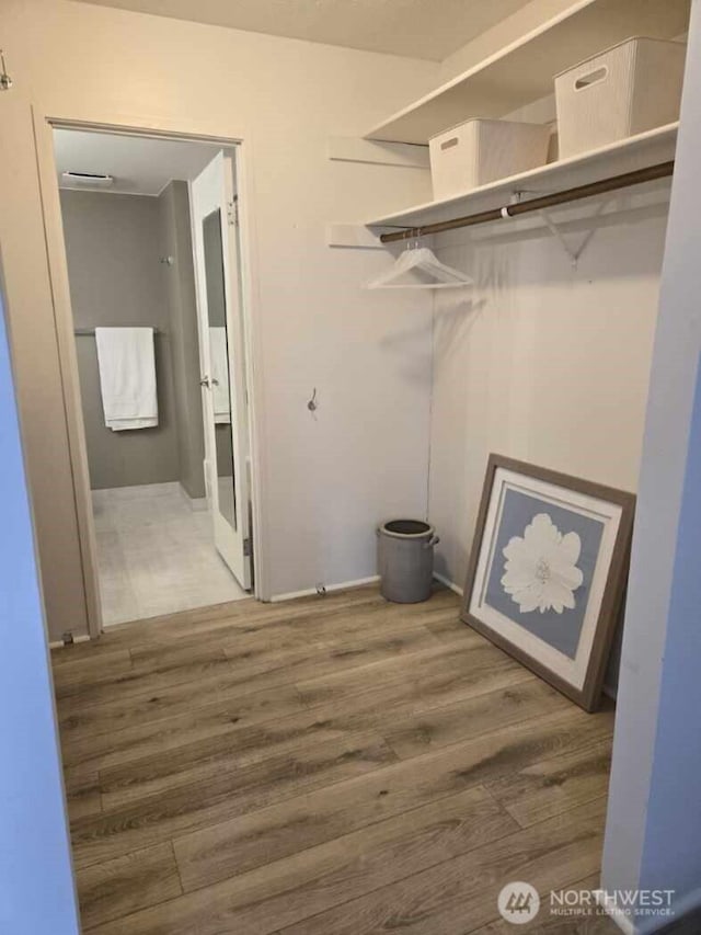 4540 8th Ave NE Unit 202, Seattle, WA 98105 - laundry area with wood finished floors