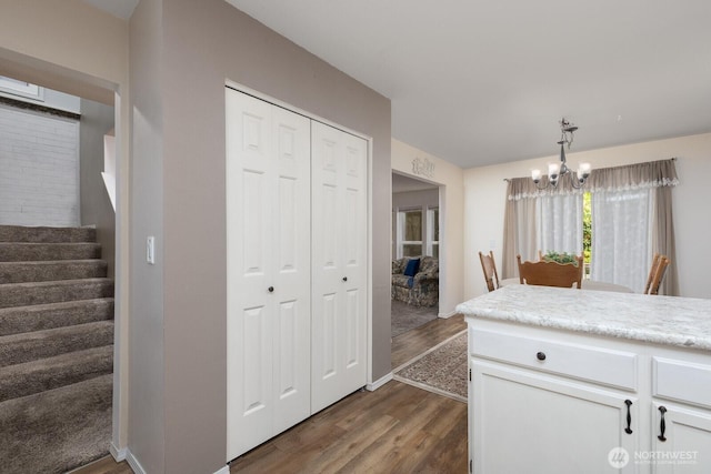 23430 100th Ave SE Unit E102, Kent, WA 98031 - kitchen featuring dark wood finished floors, a chandelier, white cabinets, and light countertops