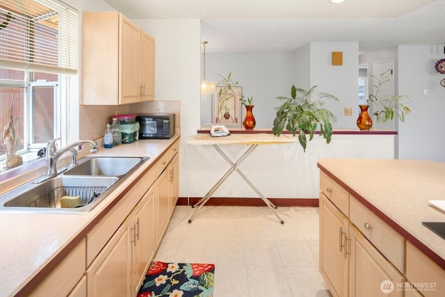 3235 33rd Ave S, Seattle, WA 98144 - kitchen with black microwave, light countertops, light brown cabinets, and recessed lighting