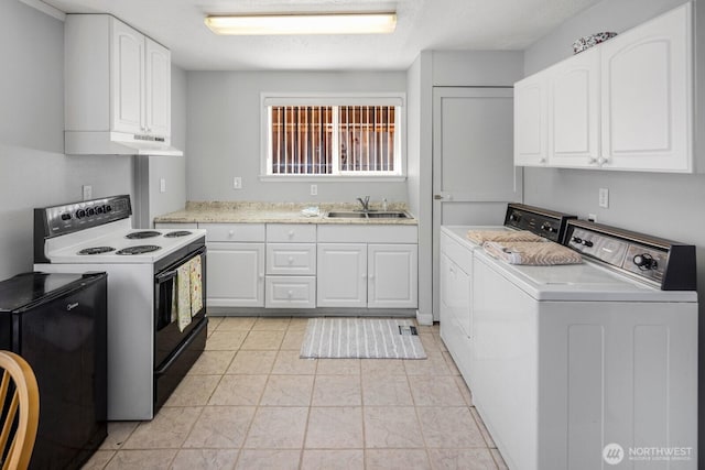 3235 33rd Ave S, Seattle, WA 98144 - kitchen featuring electric range oven, washer and clothes dryer, light countertops, white cabinetry, and under cabinet range hood