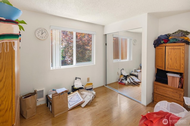 3235 33rd Ave S, Seattle, WA 98144 - bedroom featuring wood finished floors and a textured ceiling