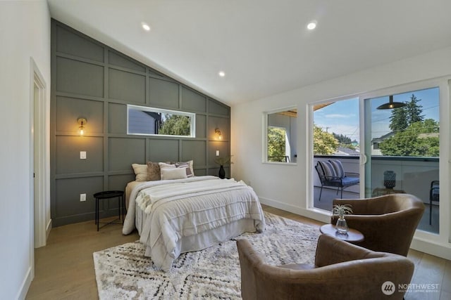 12046 5th Ave NE, Seattle, WA 98125 - bedroom with access to exterior, vaulted ceiling, light wood-type flooring, a decorative wall, and recessed lighting