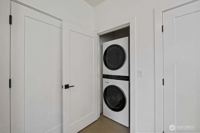 12046 5th Ave NE, Seattle, WA 98125 - washroom with stacked washer / dryer and light wood-style floors