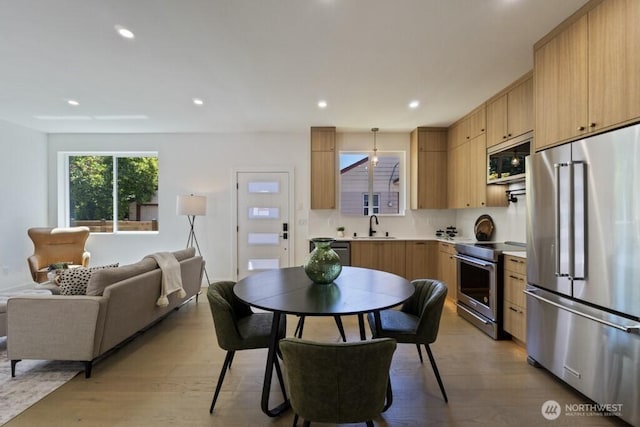 12046 5th Ave NE, Seattle, WA 98125 - dining room with wood finished floors and recessed lighting