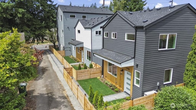 12046 5th Ave NE, Seattle, WA 98125 - view of front of property with roof with shingles and a fenced backyard