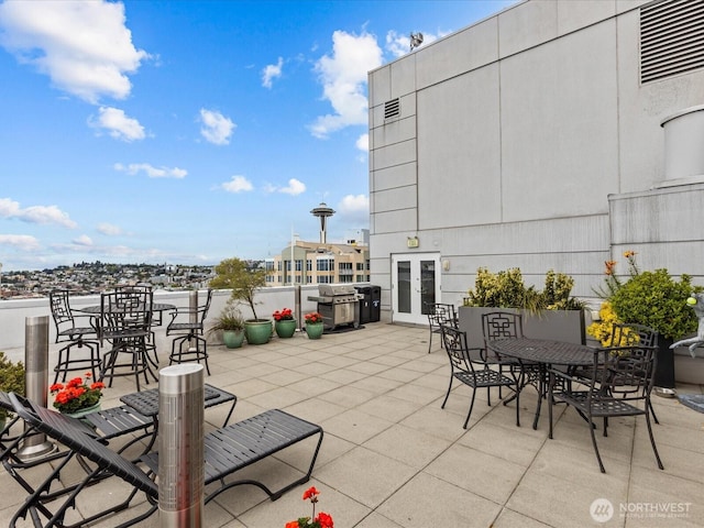 121 Vine St Unit 2405, Seattle, WA 98121 - view of patio / terrace featuring outdoor dining space, french doors, and a grill
