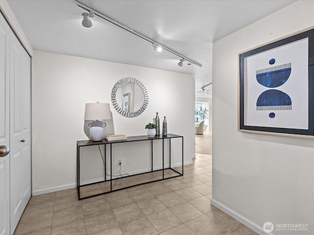 121 Vine St Unit 2405, Seattle, WA 98121 - corridor featuring track lighting and tile patterned flooring