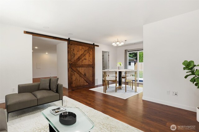 11950 SE 253rd St, Kent, WA 98030 - living area with a barn door, wood finished floors, and a chandelier