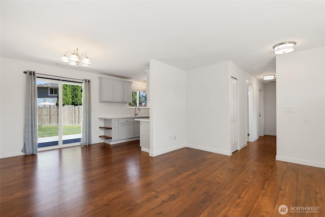 11950 SE 253rd St, Kent, WA 98030 - unfurnished living room featuring a chandelier and dark wood finished floors